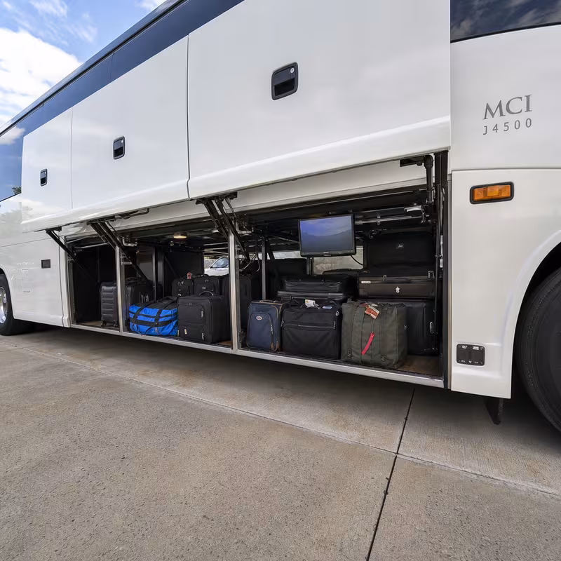 Party bus interior with wraparound leather seating and LED lighting in San Diego
