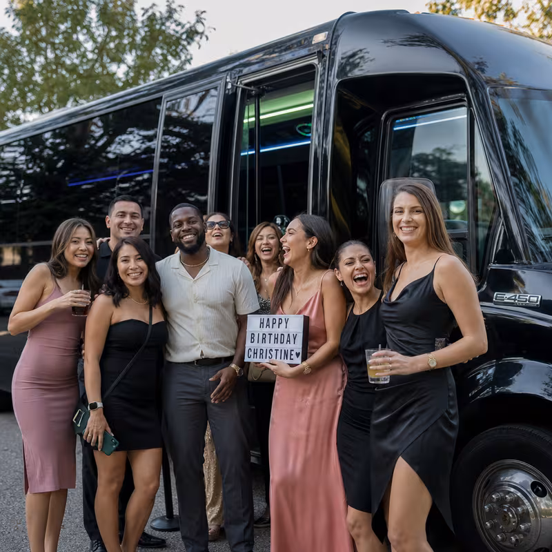 Party bus interior with wraparound leather seating and LED lighting in San Diego