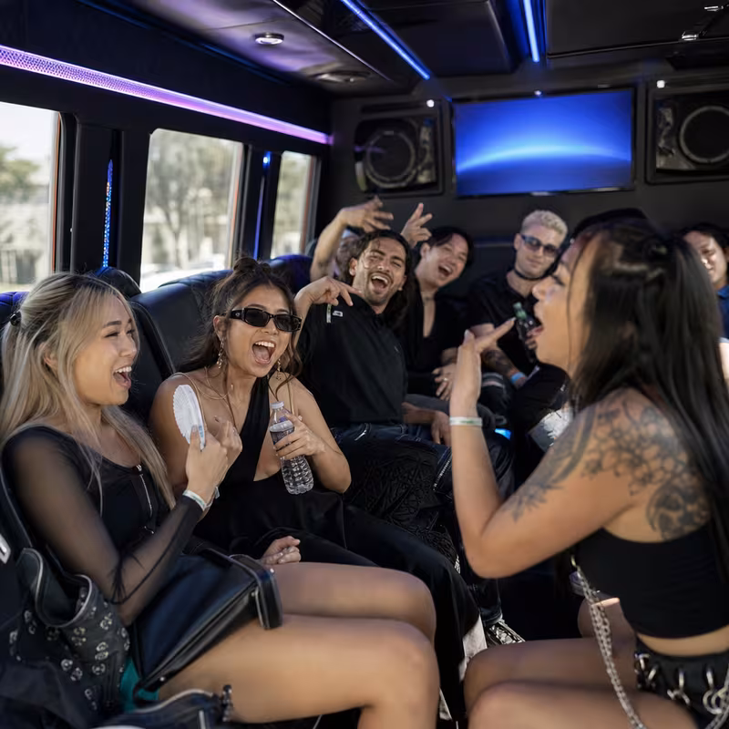 Passengers loading luggage while boarding an San Diego group shuttle