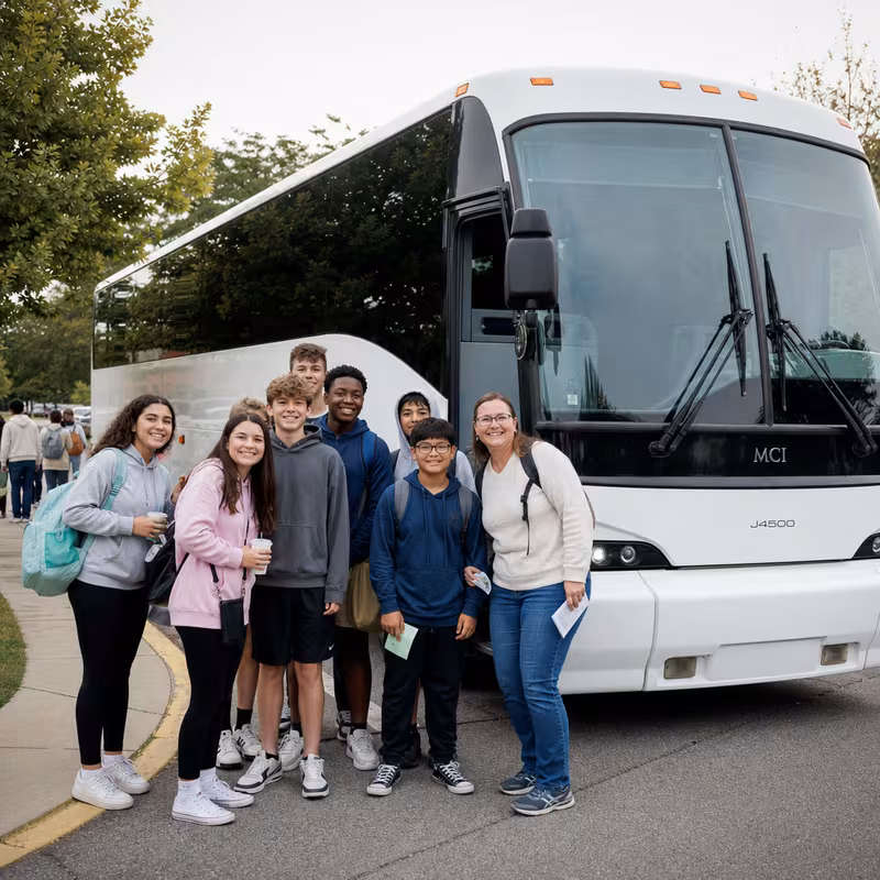 Passengers loading luggage while boarding an San Diego group shuttle