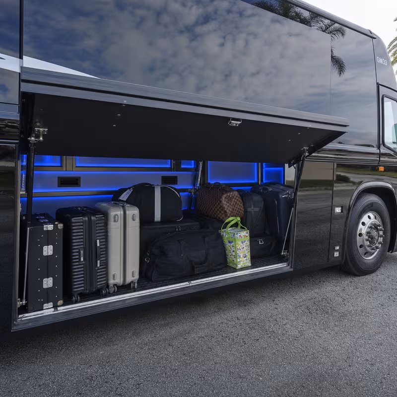 Party bus interior with wraparound leather seating and LED lighting in San Diego