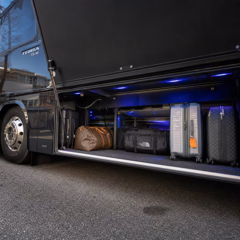 Party bus interior with wraparound leather seating and LED lighting in San Diego